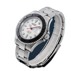 Sugess S450 white dial dive watch, black bezel, red seconds hand, steel bracelet, angled view on blue surface