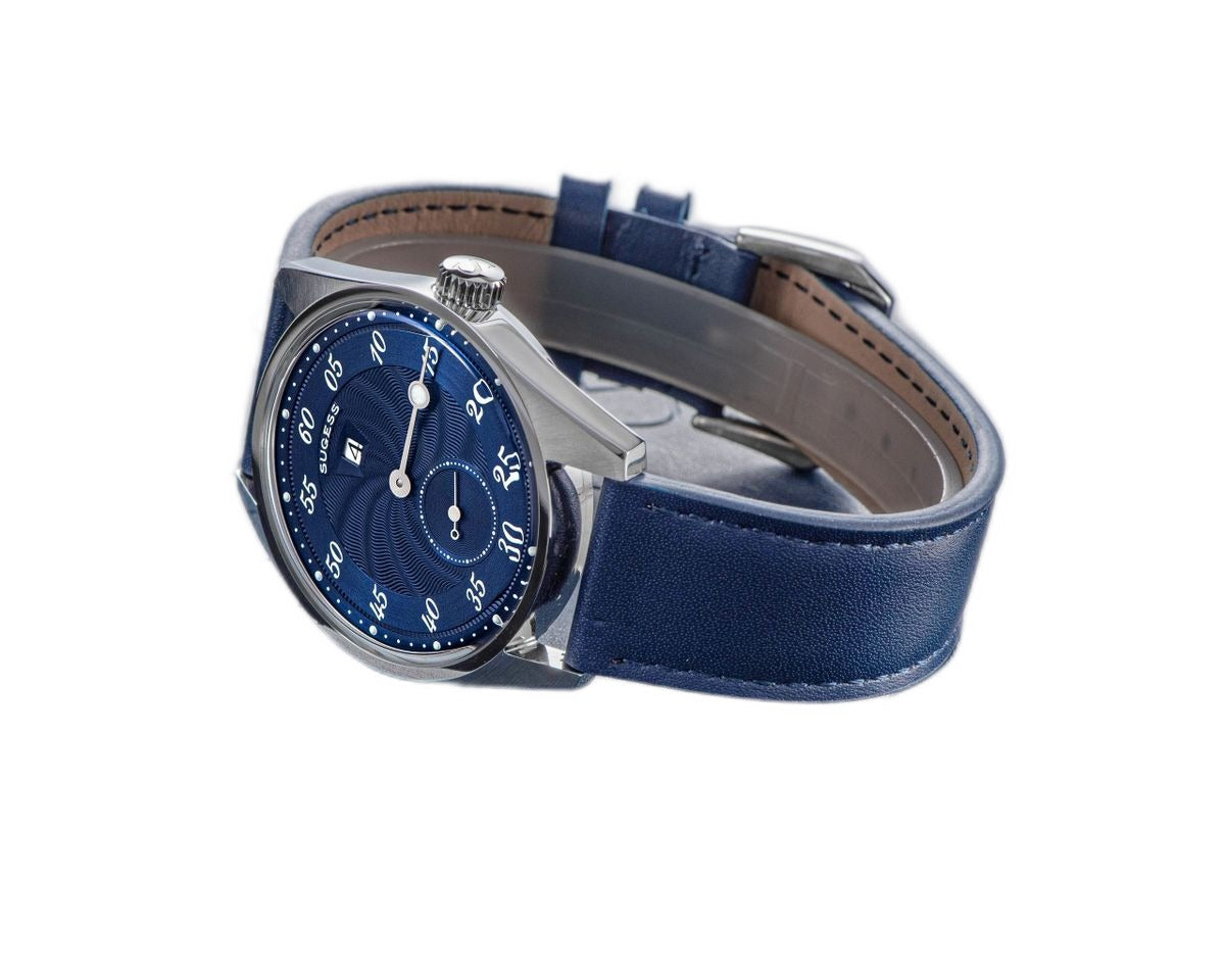 Sugess S451 royal blue guilloche regulator dress watch low side view, blue leather strap, resting on a blue box