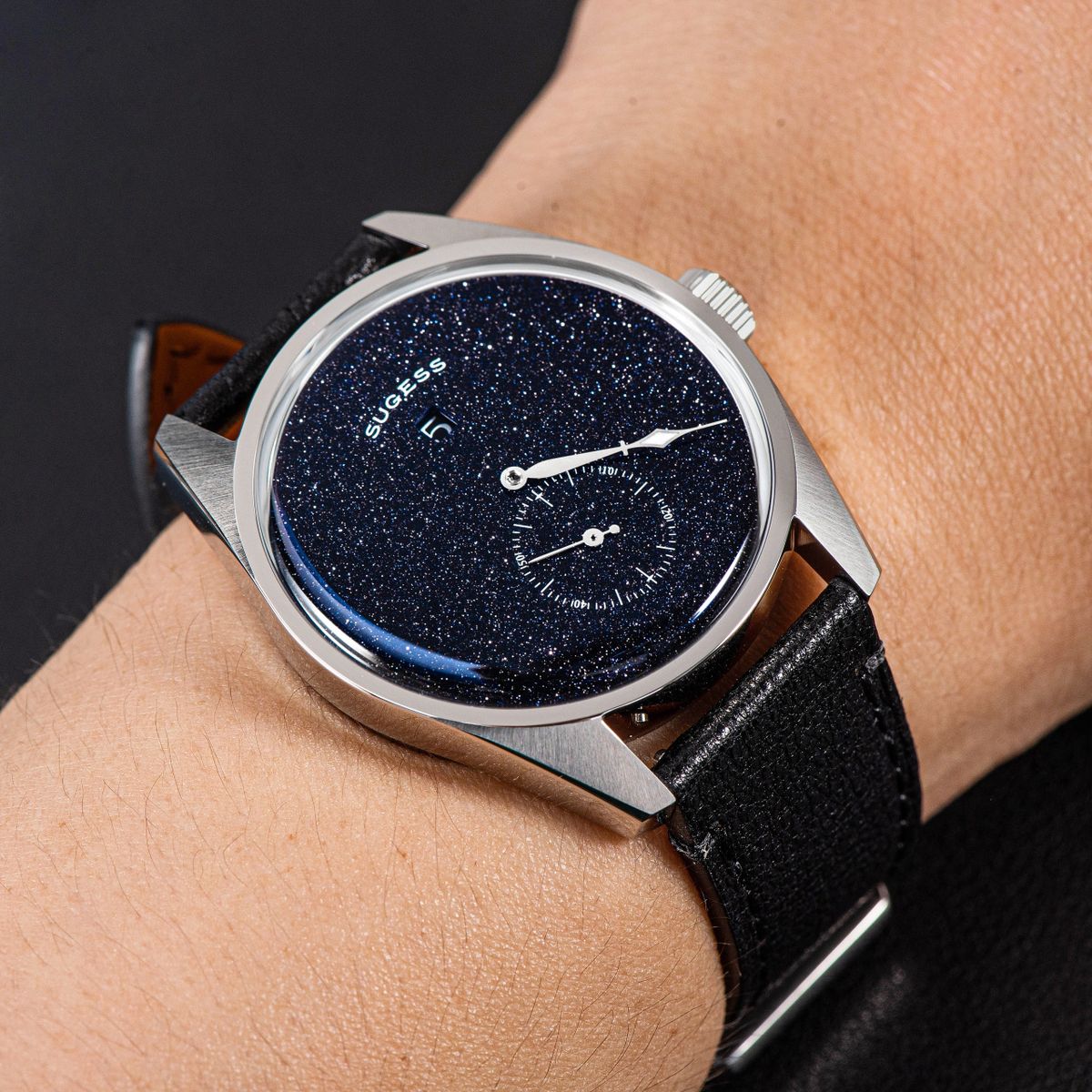 Sugess S451 blue sandstone aventurine dress watch on the wrist, black strap, sparkling starry dial close-up