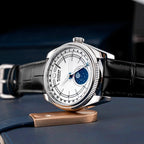 Sugess S452 steel moonphase watch, white dial, black leather strap, low side angle on a bronze stand, blue backdrop