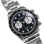 Sugess S457 black dial manual chronograph, white sub-dials, steel bracelet, front angled view on black