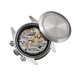 Sugess S457 chronograph manual-wind movement exposed with the caseback removed, gears and jewels, on black