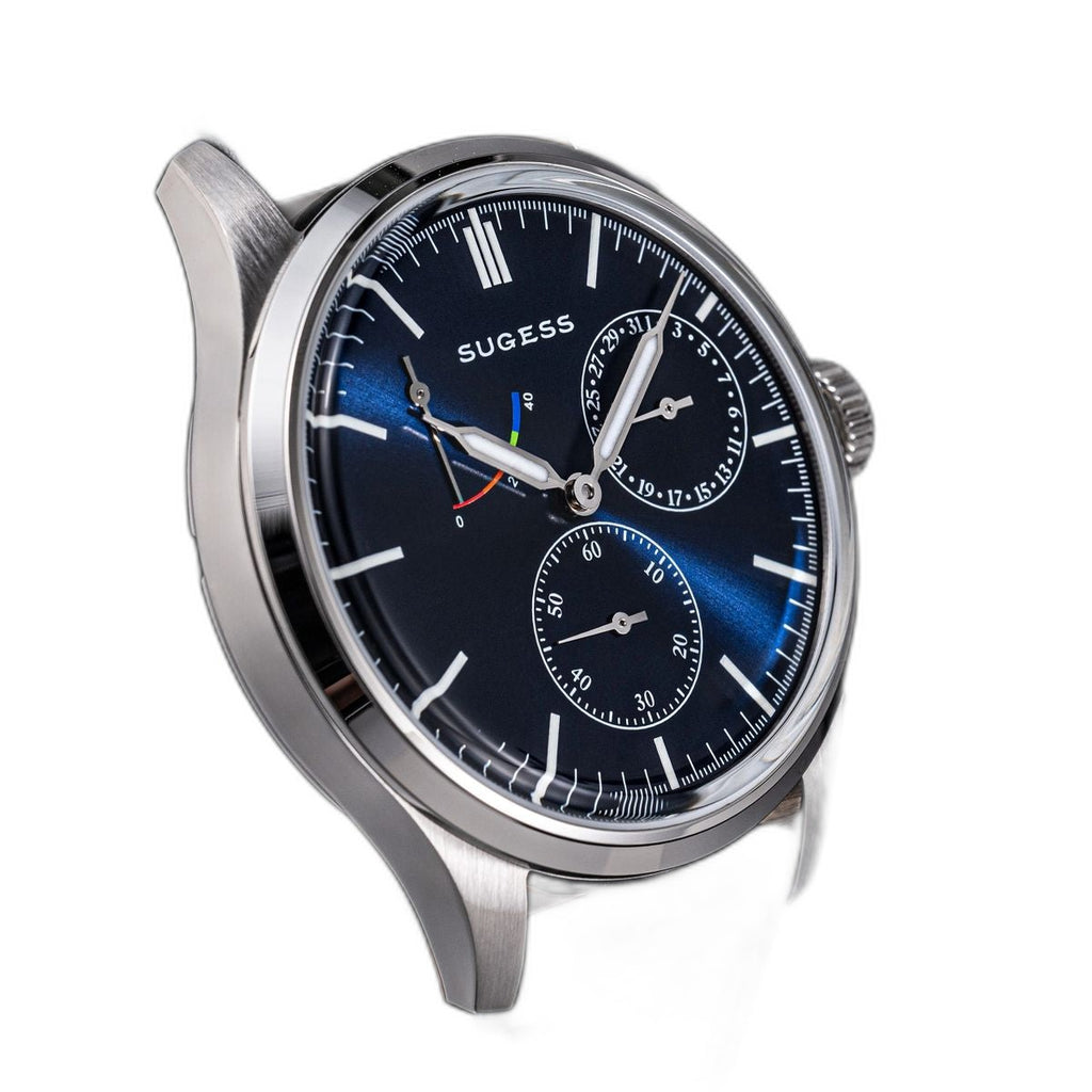 Sugess S458 blue dial power-reserve watch, navy leather strap, dramatic angled view on black