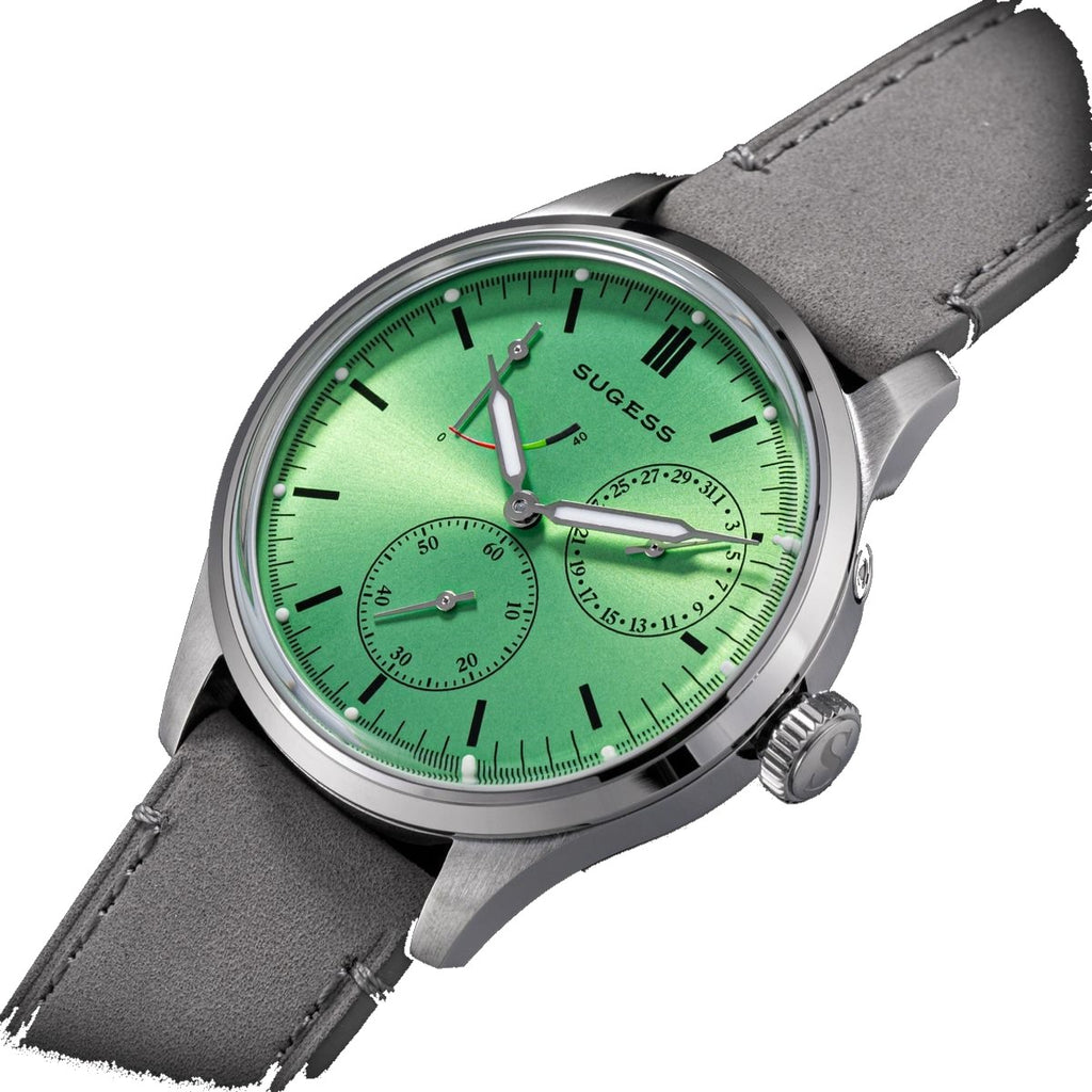 Sugess S458 green dial power-reserve watch, grey suede strap, three-quarter angled view on black