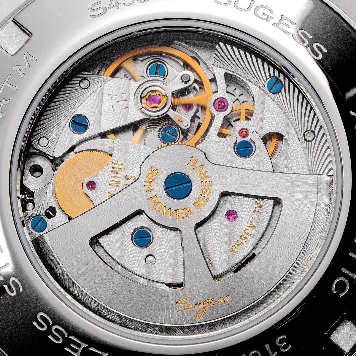 Sugess S458 automatic movement close-up through the display back, twenty-nine jewels, power reserve, blued screws