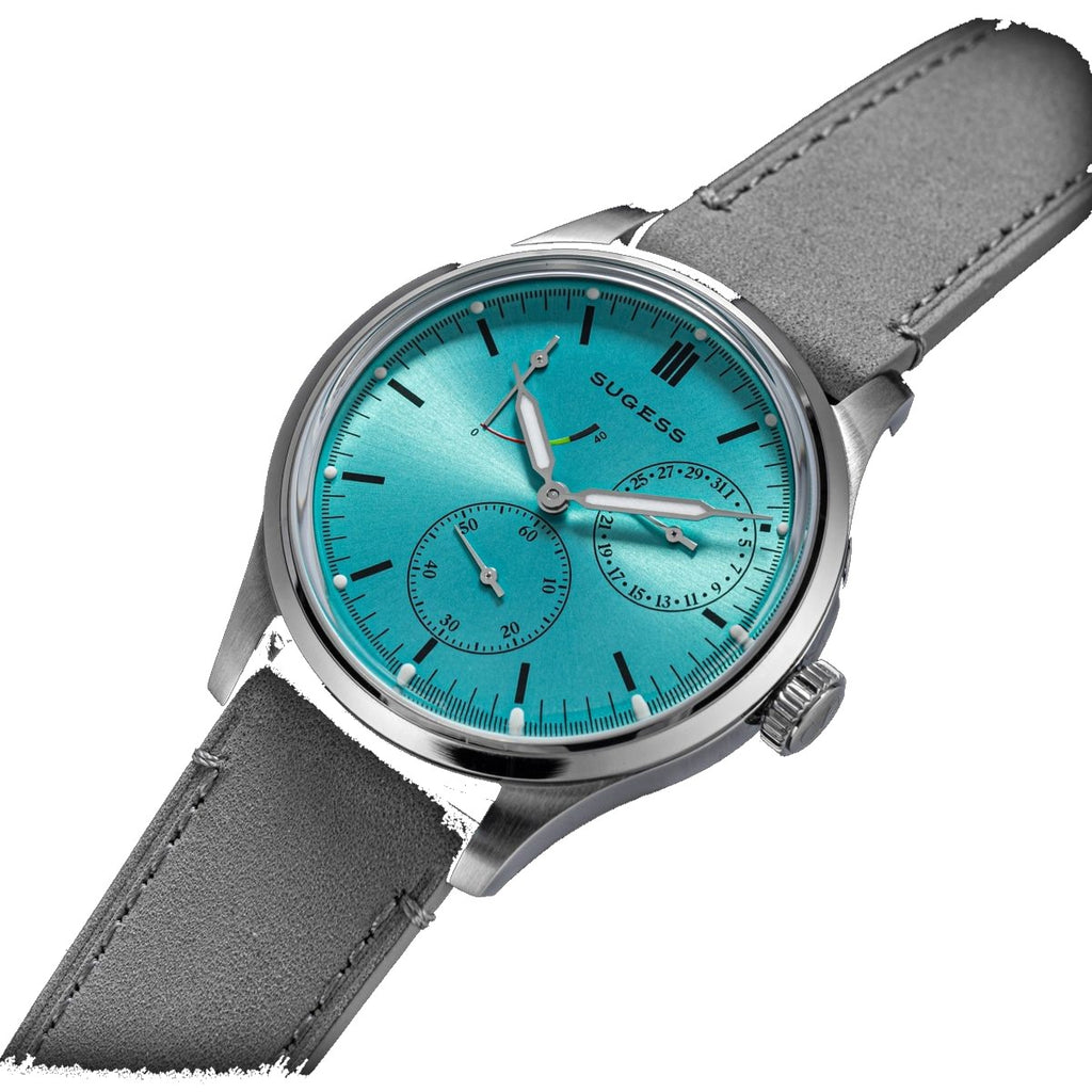 Sugess S458 petrol teal dial power-reserve watch, grey suede strap, front three-quarter view on black