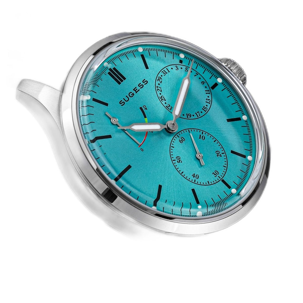 Sugess S458 petrol teal dial power-reserve watch, grey suede strap, dynamic angled view on black