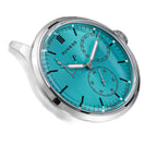 Sugess S458 petrol teal dial power-reserve watch, grey suede strap, dynamic angled view on black