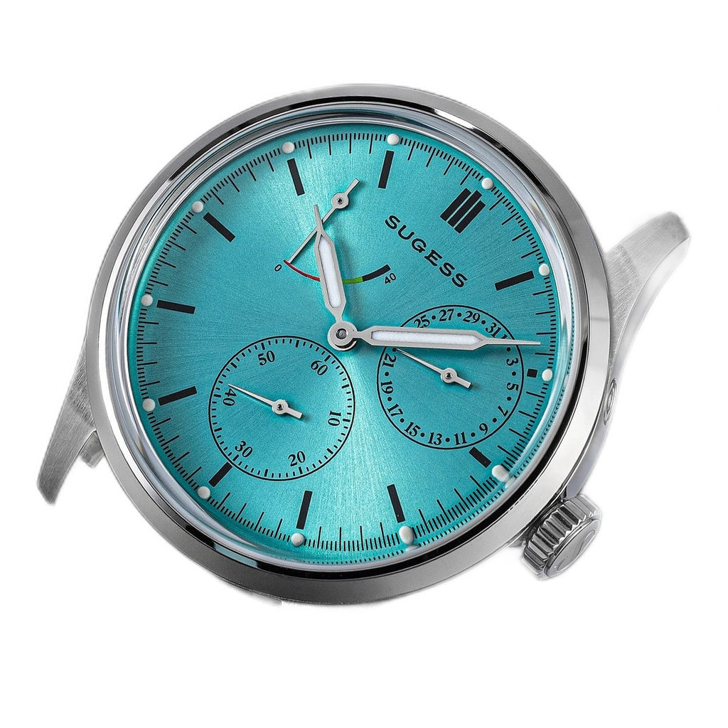 Sugess S458 petrol teal dial power-reserve watch, grey suede strap, three-quarter angled view on black