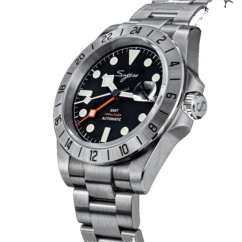 Sugess S463 GMT black dial watch, top-down angled view showing the date cyclops, steel bracelet, on black
