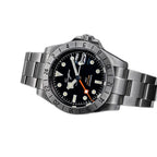 Sugess S463 GMT black dial watch, steel bracelet, three-quarter angled view on black