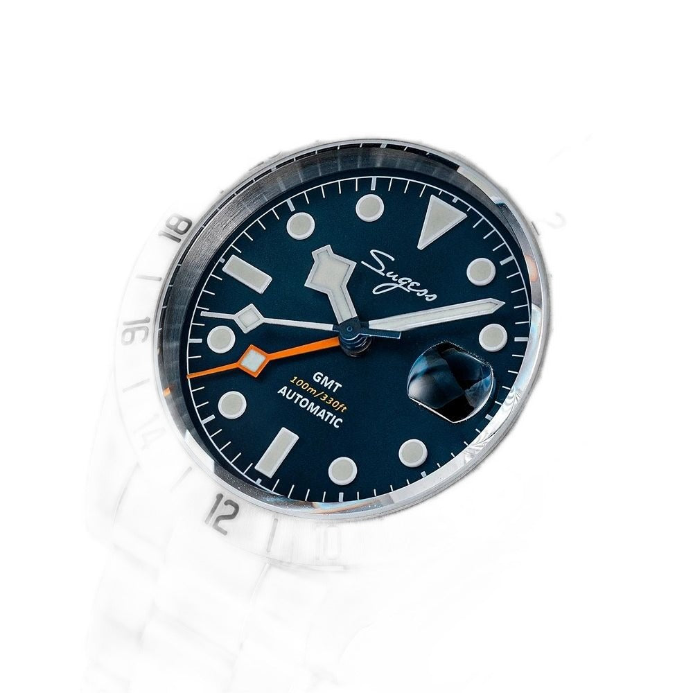 Sugess S463 GMT blue dial watch, date cyclops and orange GMT hand, steel bracelet, angled view on black