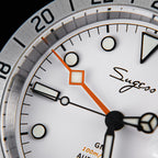 Sugess S463 white dial macro, orange diamond-tip GMT hand, luminous markers and Sugess signature, close-up