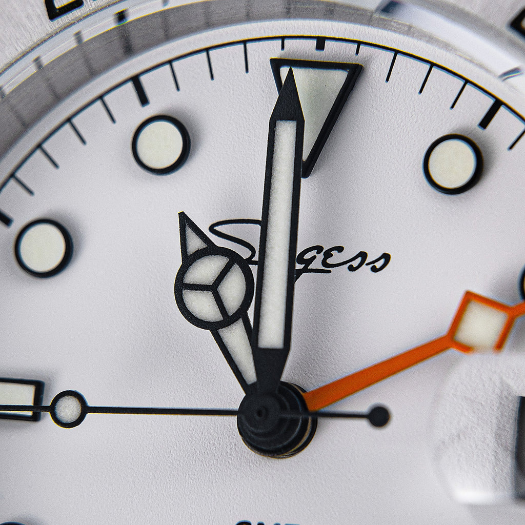 Sugess S463 white dial macro of the luminous hour and minute hands and 12 o'clock triangle marker, close-up