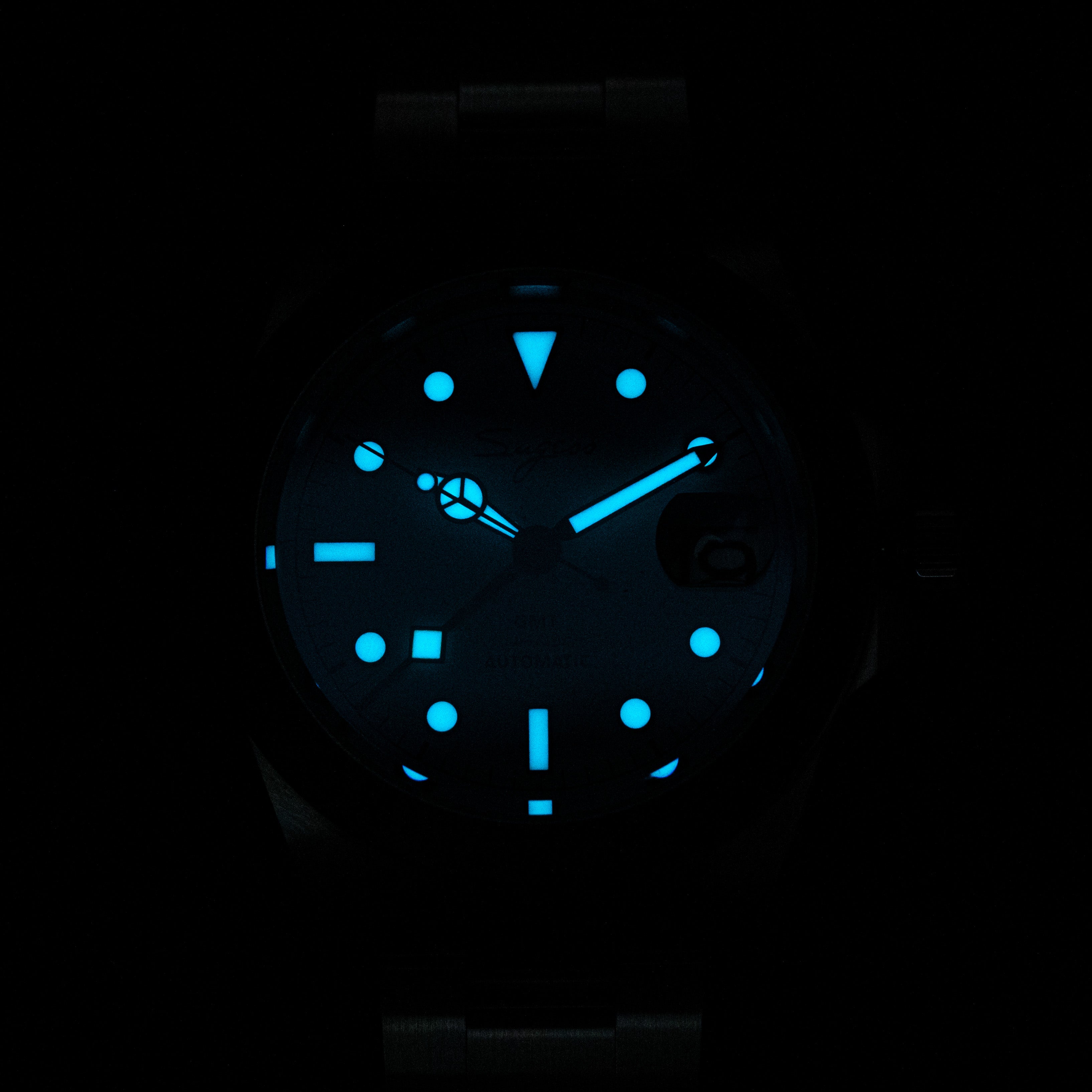 Sugess S463 dial glowing blue-green lume in the dark, luminous markers, hands and 24-hour triangle aglow
