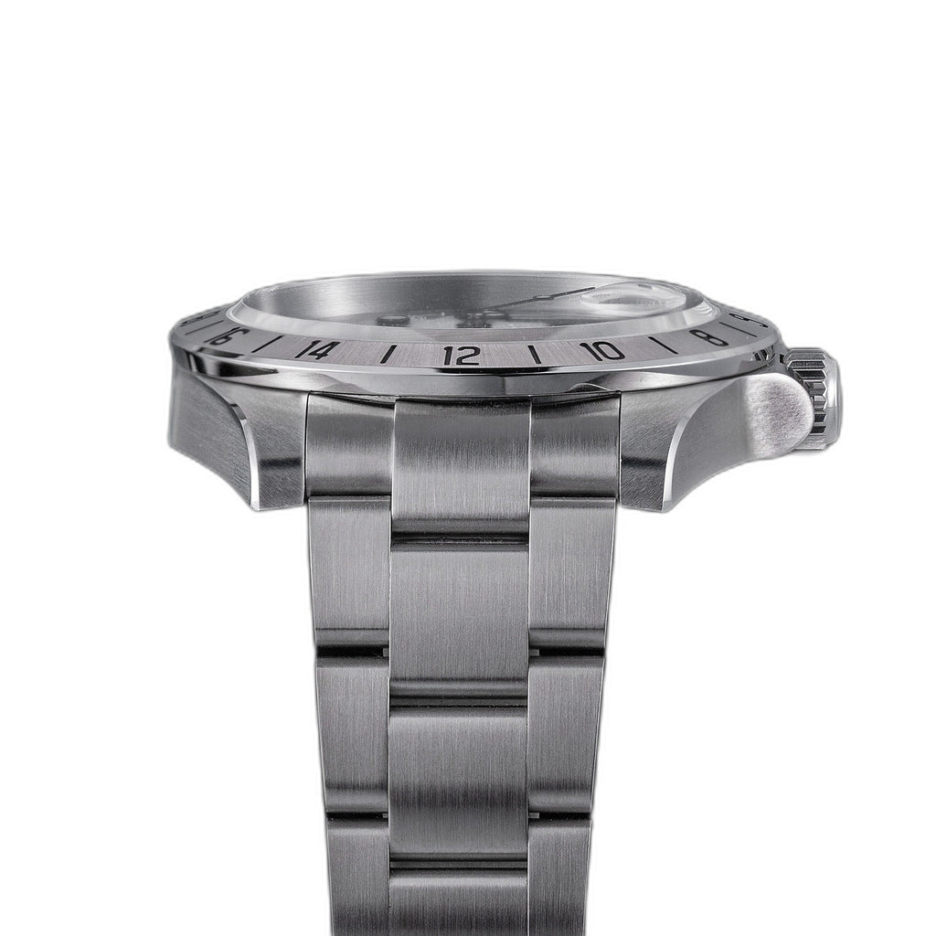 Sugess S463 white-dial GMT automatic watch, side profile showing case flank, S crown and 24-hour bezel