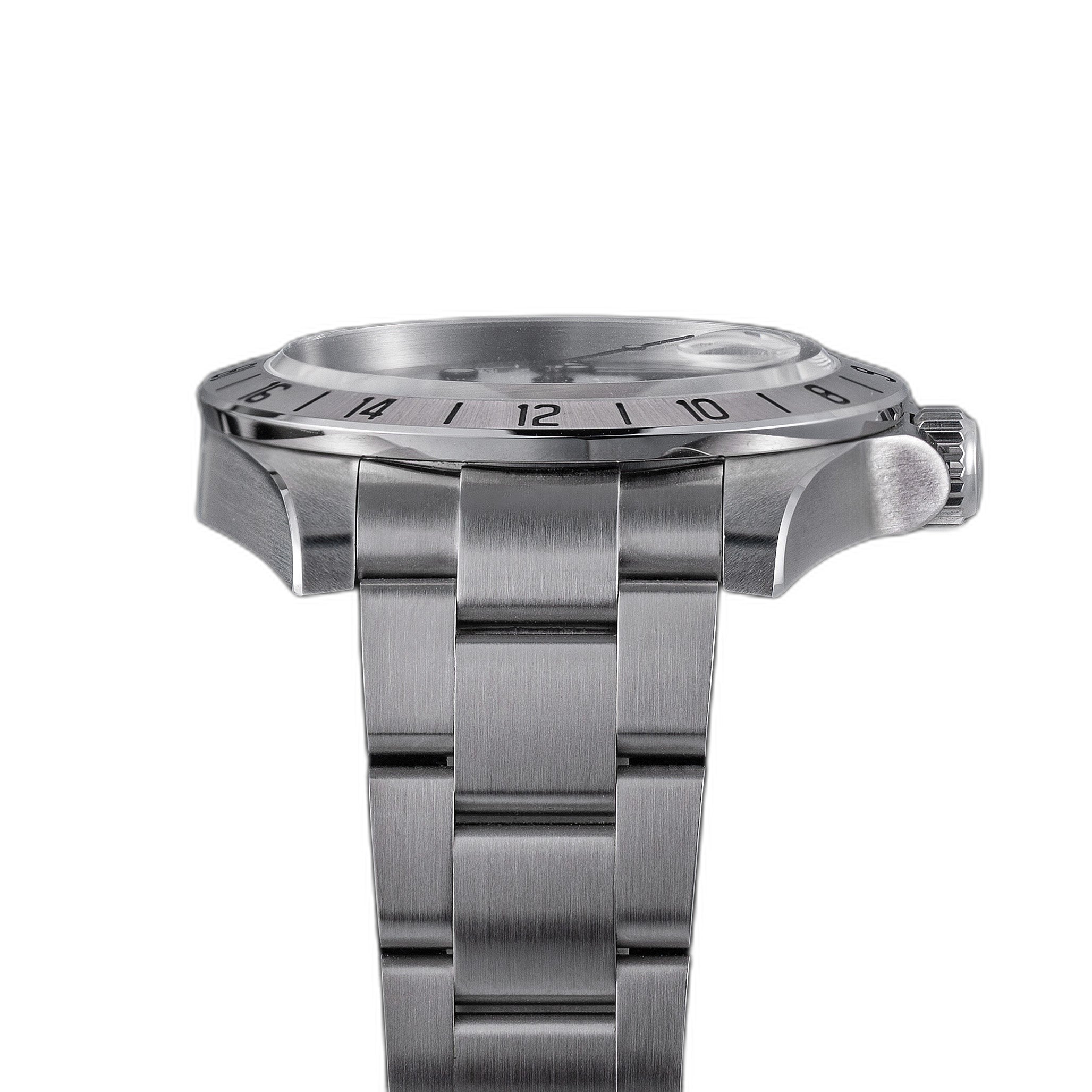 Sugess S463 white-dial GMT automatic watch, side profile showing case flank, S crown and 24-hour bezel