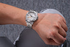 Sugess S463 white-dial GMT automatic watch worn on the wrist, steel bracelet, casual grey setting
