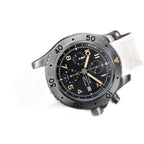 Sugess S464 titanium chronograph black dial, brown leather strap, three-quarter angled view on black