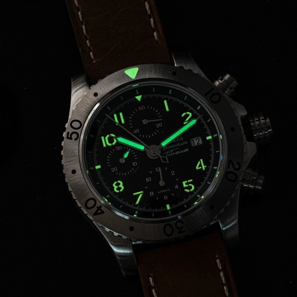 Sugess S464 chronograph black dial glowing green lume in the dark, hands, markers and bezel pip aglow