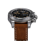 Sugess S464 titanium chronograph black dial side profile, chronograph pushers and crown, brown leather strap, on black