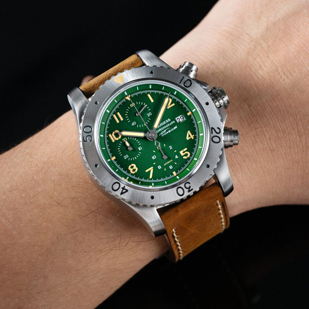 Sugess S464 titanium chronograph green dial, brown leather strap, dynamic three-quarter angle on black
