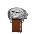 Sugess S464 titanium chronograph full-lume dial with mint tint, brown leather strap, angled flat lay on black