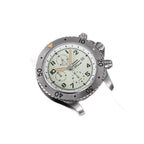 Sugess S464 titanium chronograph full-lume dial with mint tint, brown leather strap, three-quarter angle on black