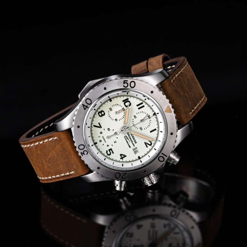 Sugess S464 titanium chronograph full-lume cream dial side profile, pushers and crown, brown strap, on black