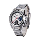 Sugess S465 chronograph, silver dial with blue and grey sub-dials, steel bracelet, angled view on dark wood