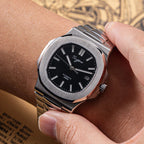 Sugess S466 black dial sport watch held over the wrist, integrated steel bracelet