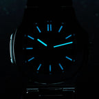 Sugess S466 sport watch dial glowing blue lume in the dark, applied markers and hands aglow, close-up