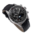 Sugess S468 moonphase chronograph, steel case, black dial, black leather strap, three-quarter angled view on black