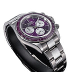 Sugess S473 Chrono Racing automatic chronograph, purple dial, steel bracelet, angled view over a grey surface