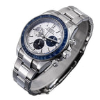 Sugess S473 Chrono Racing silver-white dial, blue bezel, S-engraved crown, steel bracelet, angled view on black