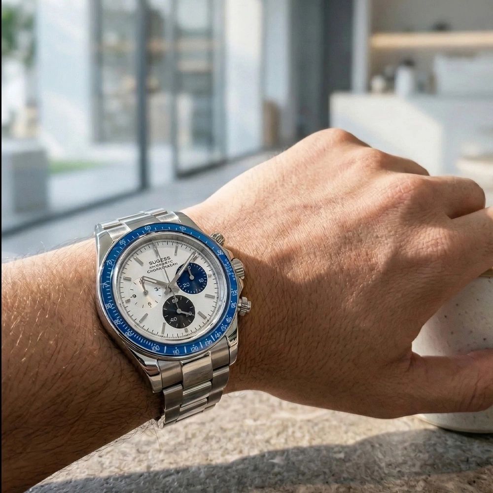 Sugess S473 Chrono Racing silver-white dial automatic chronograph worn on the wrist in a bright room, steel bracelet