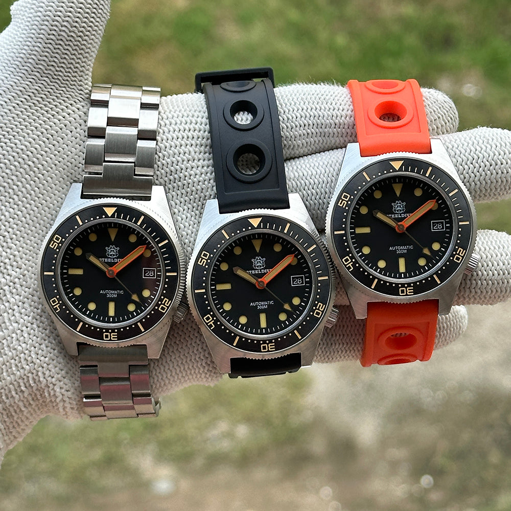 Three STEELDIVE SD1929V watches on a steel bracelet, black rubber and orange rubber straps