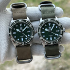 Two STEELDIVE SD1925 watches side by side on khaki and army green nylon straps