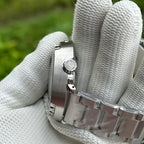 Side profile of the STEELDIVE SD1975B showing the signed crown and steel bracelet